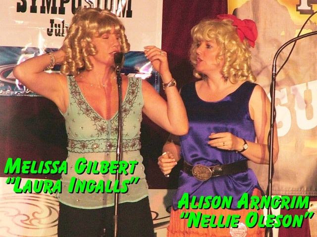 Melissa Gilbert (Laura Ingalls) & Alison Arngrim (Nellie Oleson) ham it up on stage at the Little House on the Prairie reunion in Tombstone